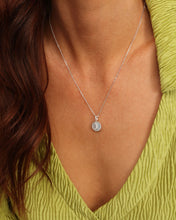 Load image into Gallery viewer, Close up of model wearing medallion necklace
